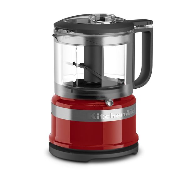 KitchenAid KFC3516ER 3.5-cup food chopper in Empire Red, with clear handled bowl, black lid and multipurpose blade visible