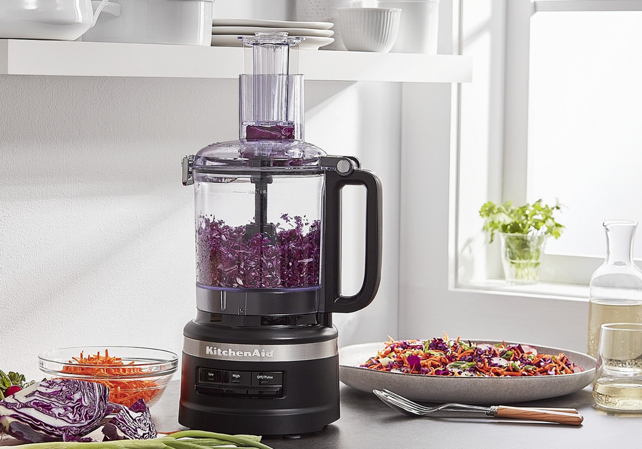 KitchenAid 9 Cup Food Processor Plus in the manufacturer's Contour Silver refurbished product image, processing purple cabbage