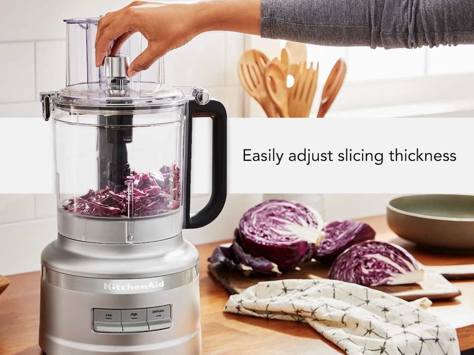 KitchenAid KFP1318CU in Contour Silver processing shredded cabbage in a manufacturer feature image